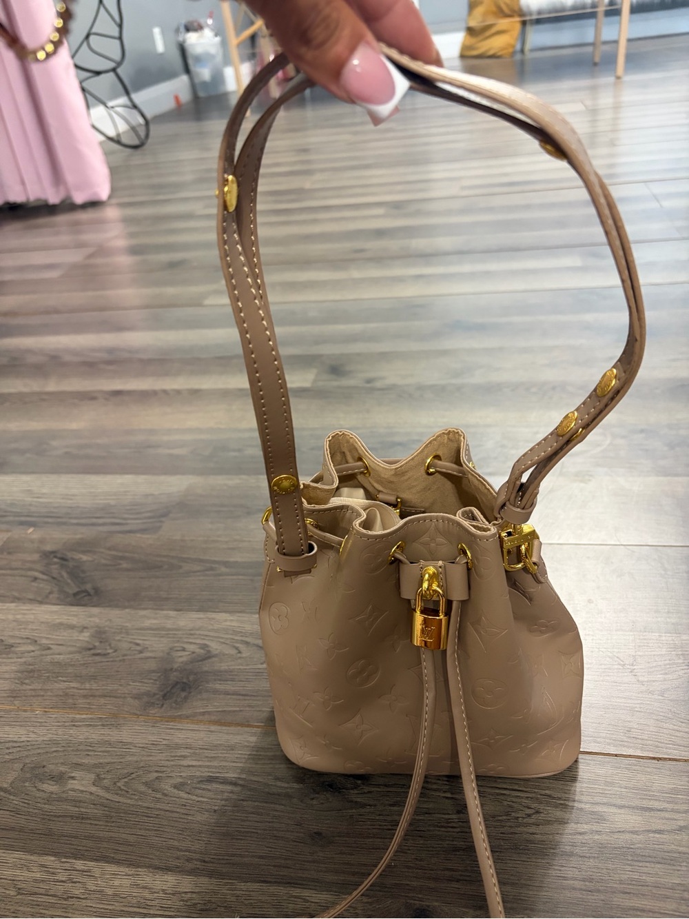Mini Beige Drawstring Bucket Bag with Gold Accents